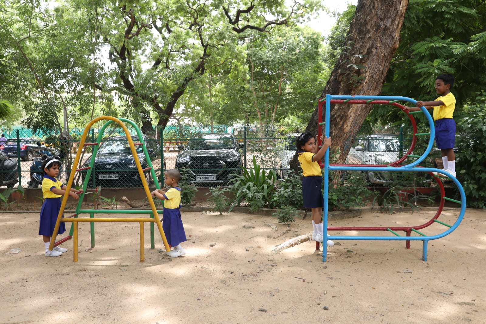 OLIS students playing together at the playground
